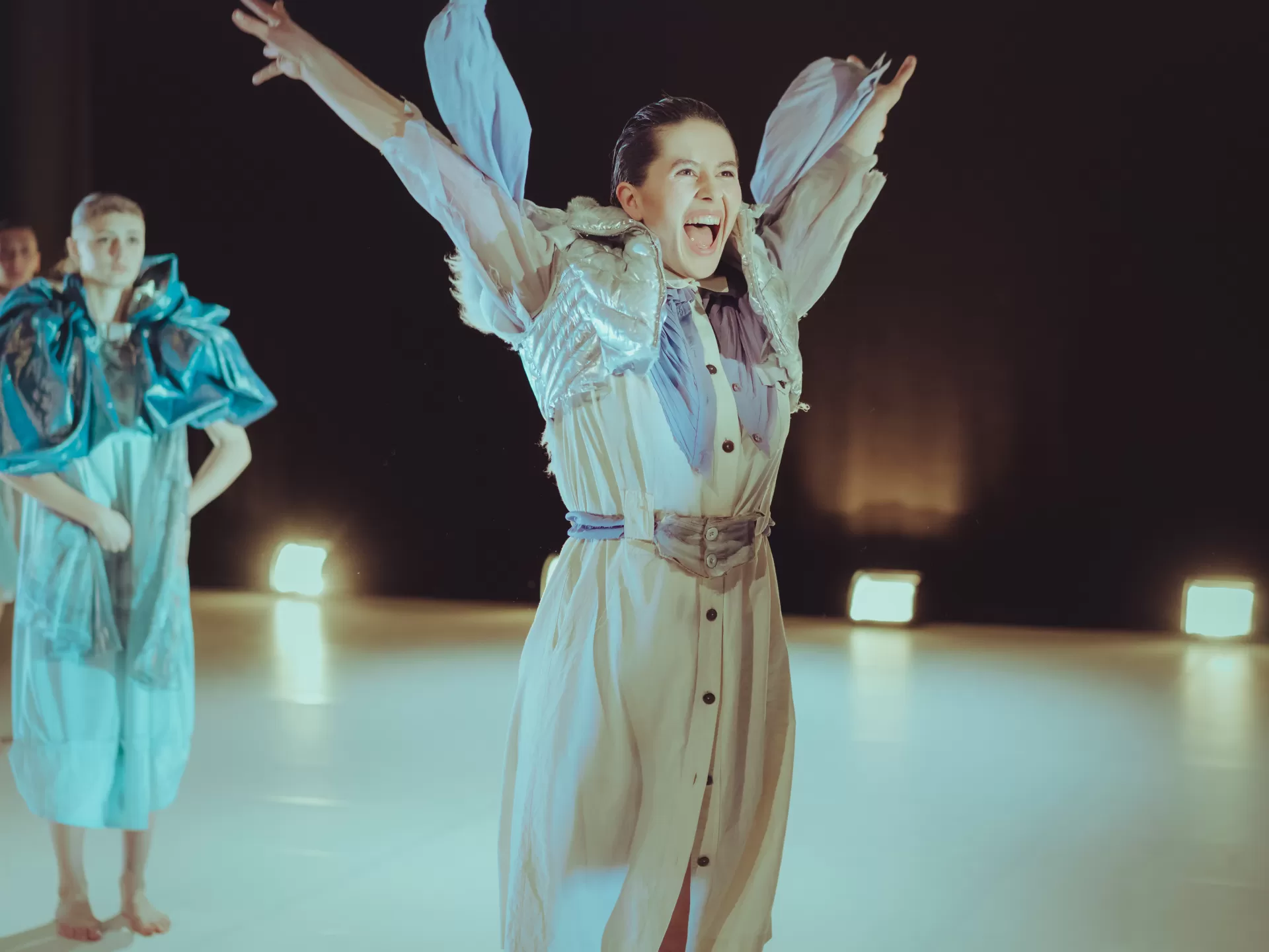 woman on stage, extremely smiling