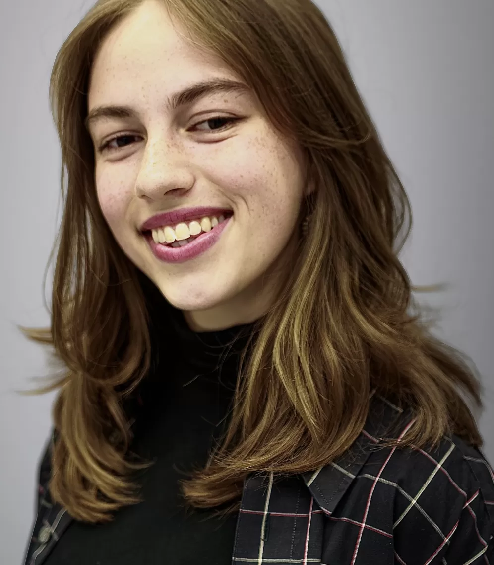 Portrait of Emilie who is smiling into the camera 