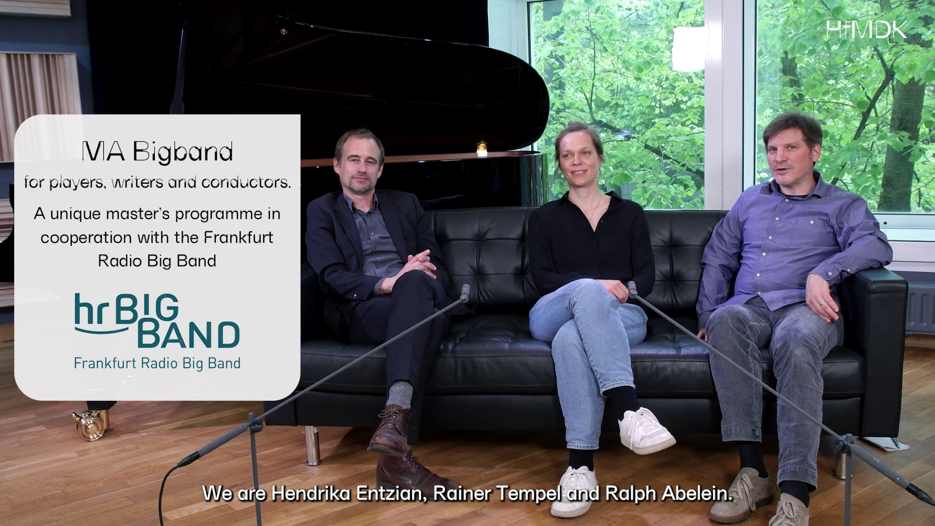 The MA Bigband teaching team sitting on a black sofa.