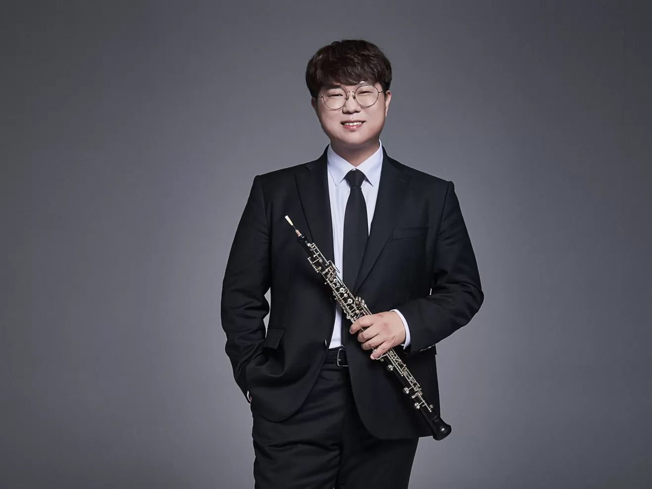 Porträt von Yongjin Jun mit seiner Oboe